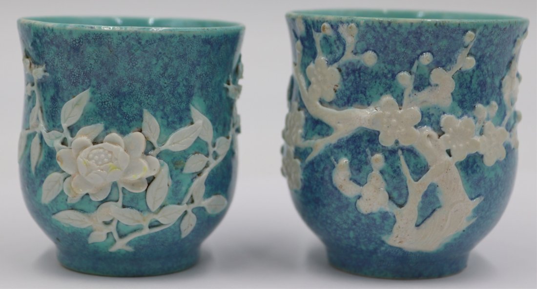 Pair of Chinese Qing Dynasty Wine Cups.: Pair of Chinese robin's egg blue wine cup with white floral decoration. Qing dynasty. From a White Plains, NY estate. Dimensions: cups measure approx. 2.25" w x 2.375" h.
