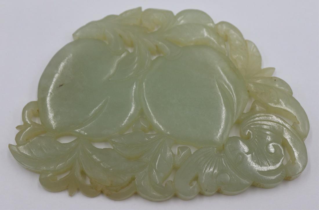 Carved Jade Pendant.: Carved jade pendant depicting peaches and a single bat. Both sides carved. Total approx. weight is 50.3 grams (gross). From a Cos Cob, CT estate. Dimensions: pendant measures approx. 3.36" w x 2.
