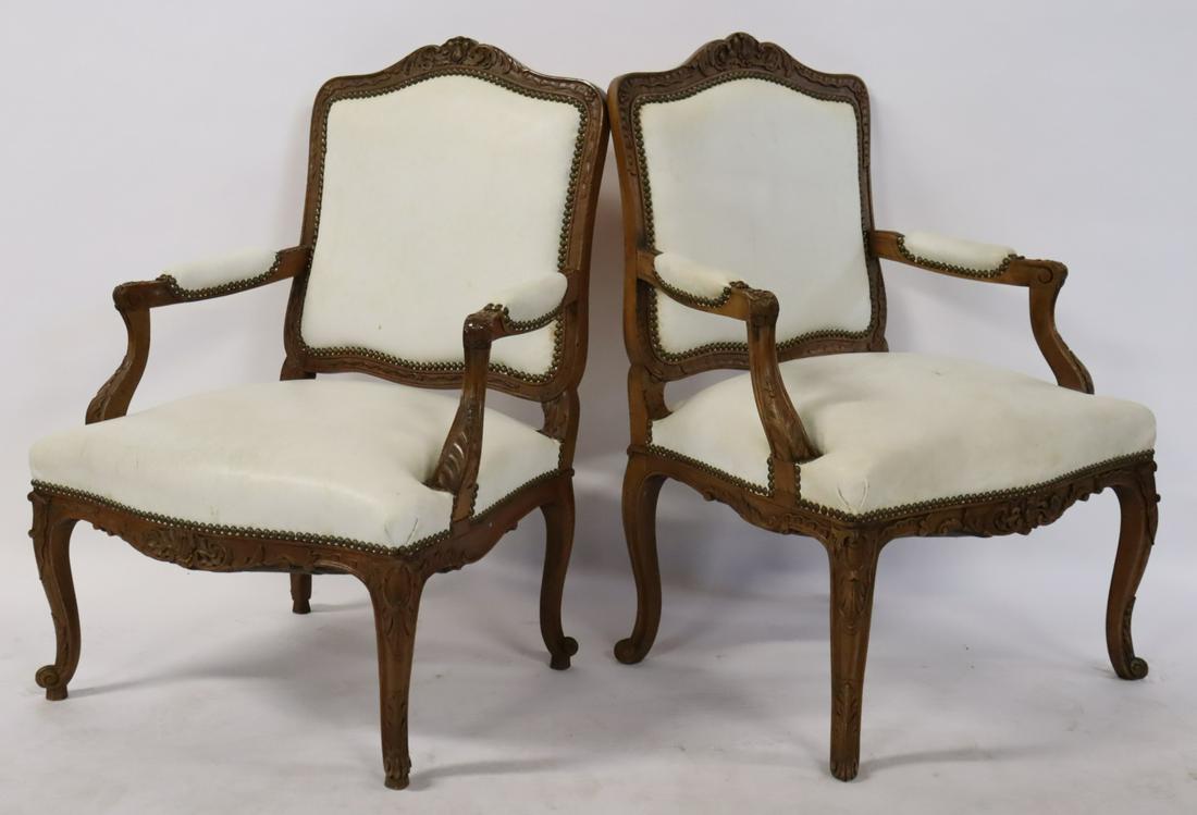 A Pair Of Louis XV Style Carved Arm Chairs .: From a Darien CT estate. -Dimensions: 38" h x 26" w x 21" d