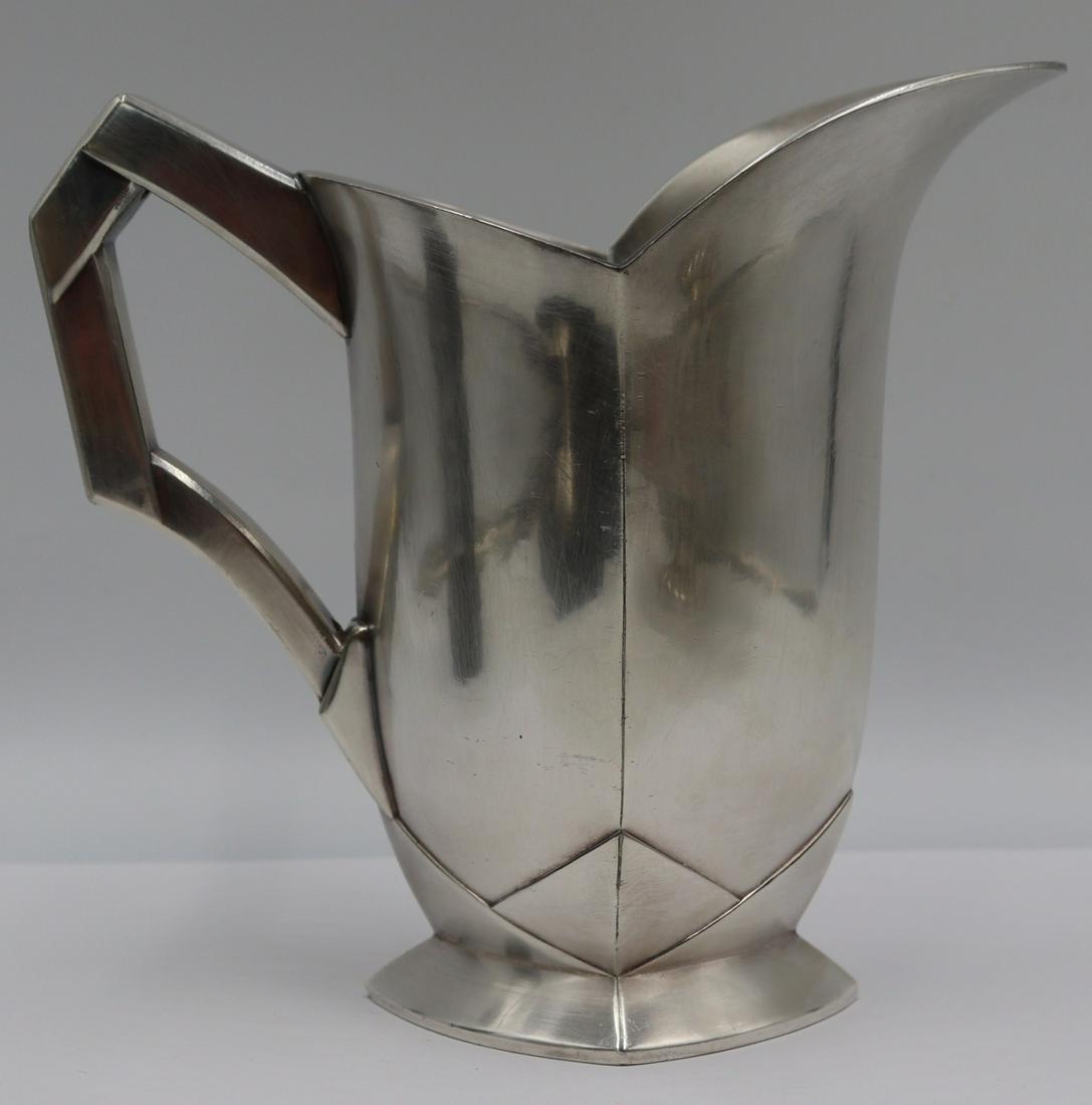 SILVERPLATE. Louis Sue and Andre Mare for Gallia: Silverplate Water Jug. Stamped to underside, "Gallia 5978" alongside two pictorial hallmarks. From an E 66th St, Manhattan estate. Dimensions: jug measures approx. 7.125" h.