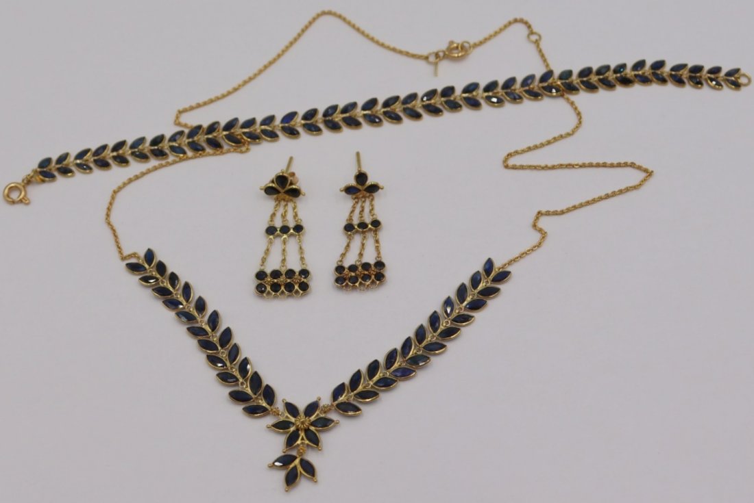 JEWELRY. 18kt Gold and Faceted Gem Suite.: Includes a matched 18kt yellow gold bracelet and necklace of foliate form comprised of faceted marquis cut colored gems, most probably sapphires. Accompanied by a well matched pair of 18kt gold drop e