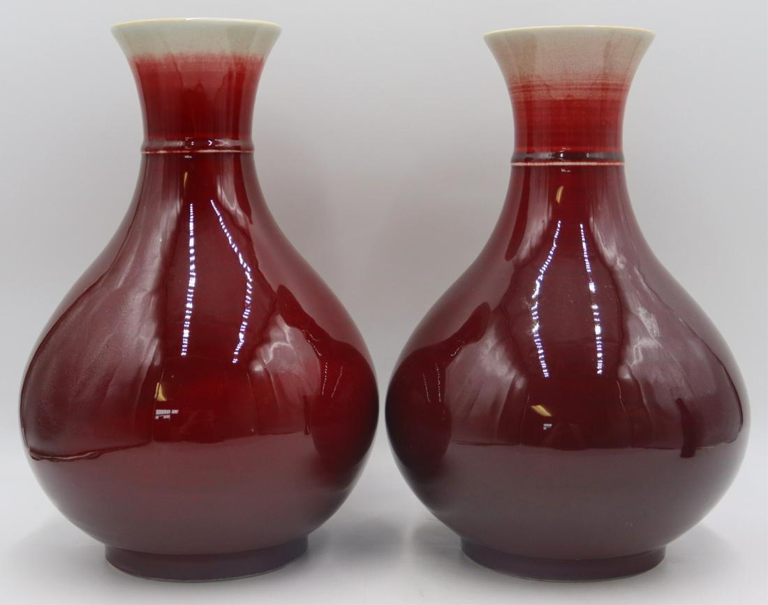 Pair of Signed Sang de Beouf Vases.: Etched signature to the underside of each vase. From a Flushing, NY estate. Dimensions: vases measure approx. 12.5" high.