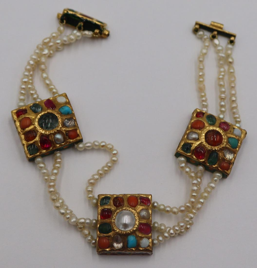 JEWELRY. Mughal High Karat, Pearl and Gem Bracelet: Mughal triple strand seed pearl bracelet comprised of (3) rectangular high karat/22ct pendants inlaid with colored gems and pearls, and a high karat/22ct closure. Each of the (3) pendants is decorated