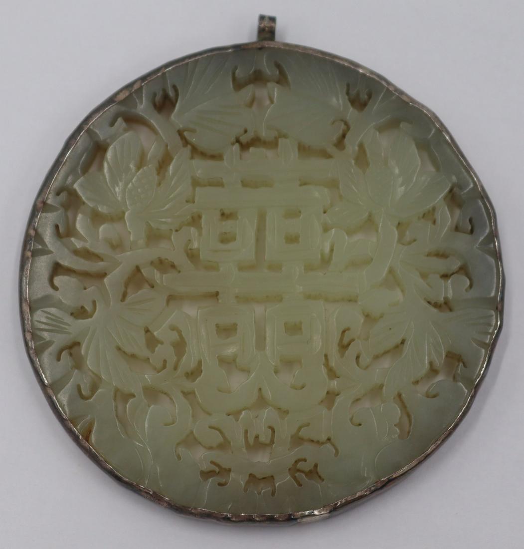 JEWELRY. Carved Jade Pendant.: Silver mounted carved jade pendant with central character surrounded by floral border. Total approx. weight is 33.7 grams (gross). From a Flushing, NY estate. Dimensions: pendant measures approx. 2.25