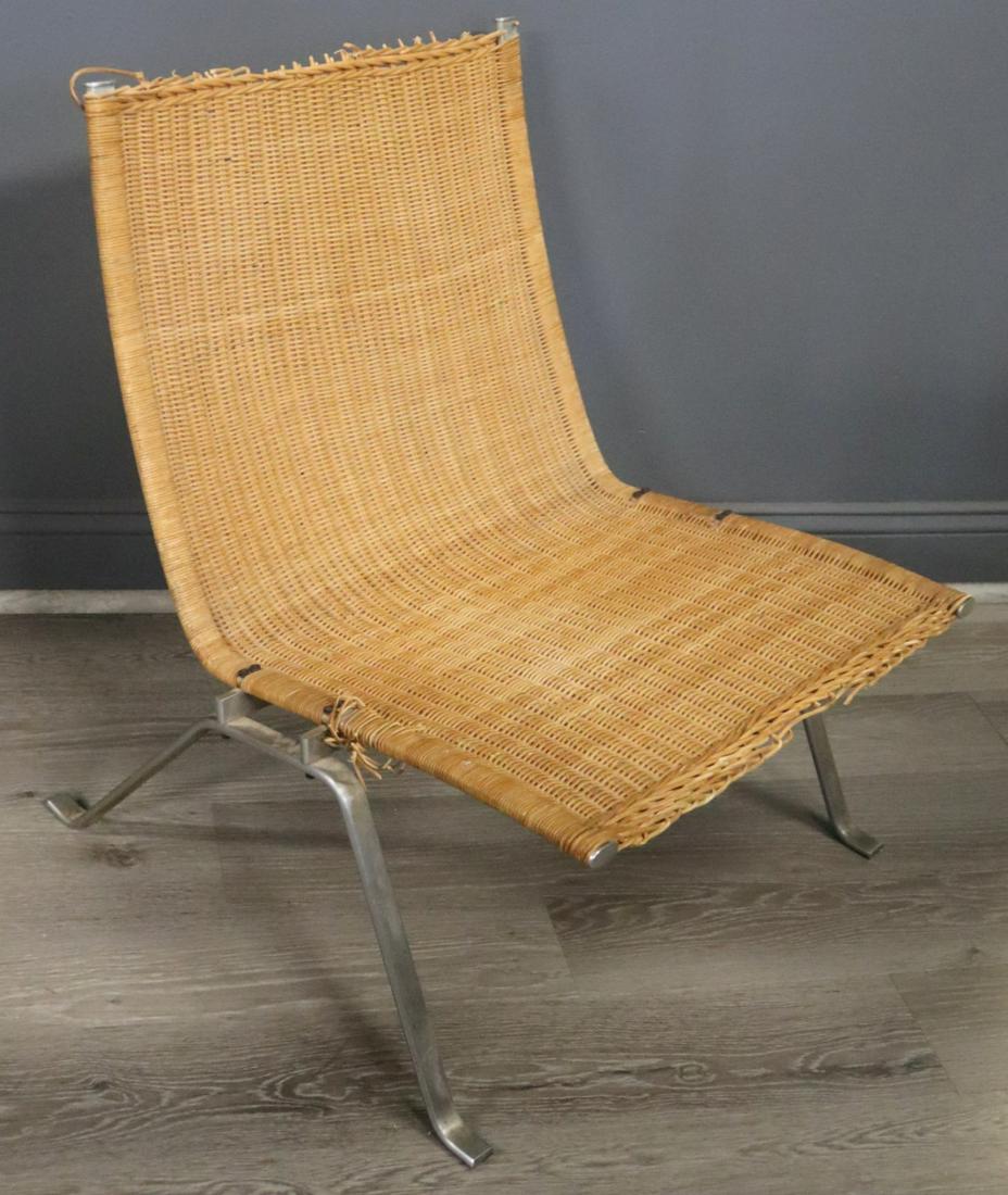 Poul Kjaerholm PK-22 Caned Stainless Chair.: Midcentury Poul Kjaerholm stainless steel chair with caned seat. Marked to underside of stretcher. From a Rye Brook, NY estate. Dimensions: 25" w x 22.5" d x 29.25" h.