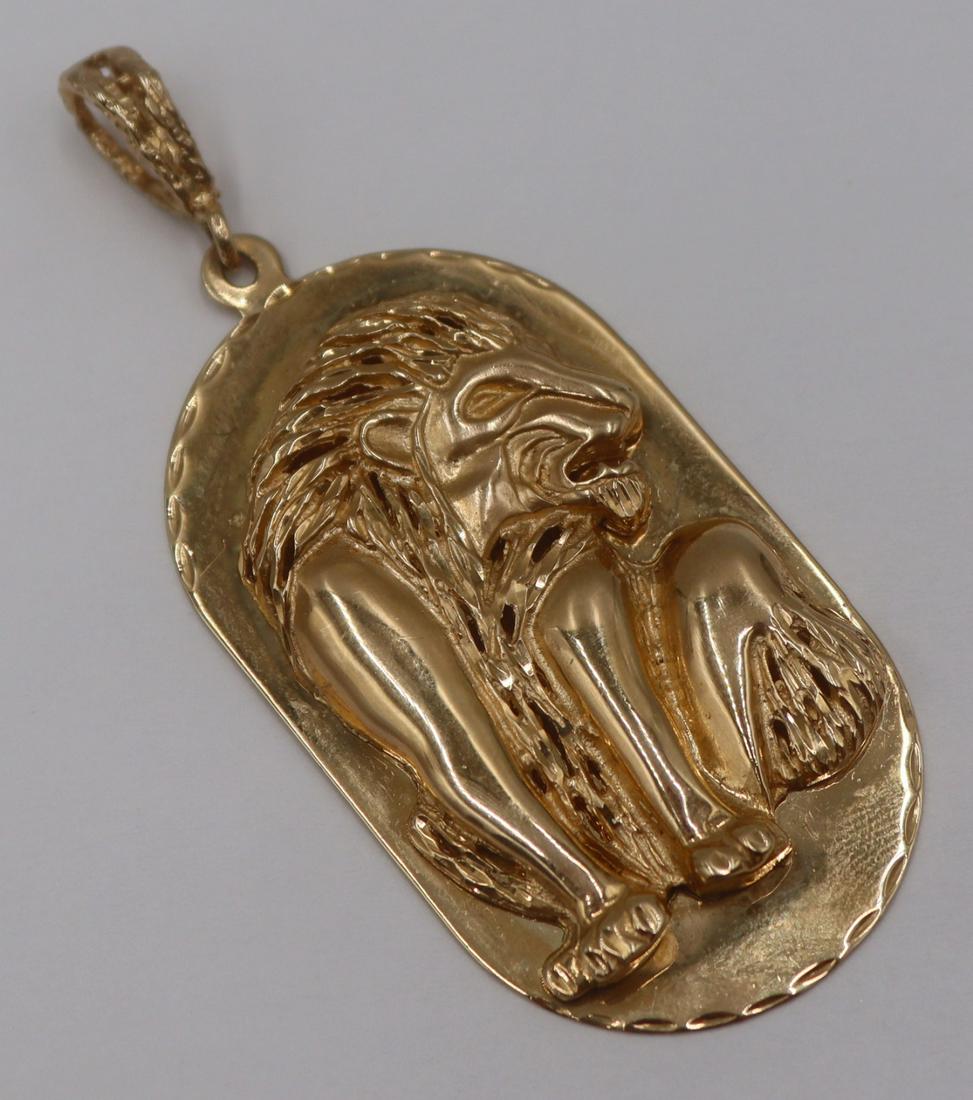 JEWELRY. Signed 14kt Gold Lion Dog Tag Pendant.: Signed 14kt yellow gold pendant in the form of a dog tag with applied seated lion (sejant) with textured bail. Stamped verso, "14KP GD". Total approx. weight is 14.1 dwt (gross). From a Dari