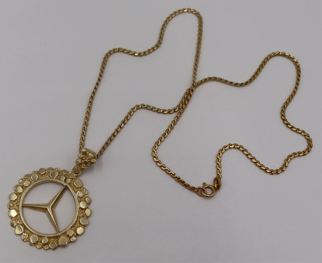 JEWELRY. 14kt Gold Mercedes Pendant and 14kt Gold: Chain. Circular 14kt yellow gold "Mercedes" symbol pendant with beautifully textured and polished finish - stamped, "14K" to bail. Pendant is suspended from an Italian Uno-a-Erre 1