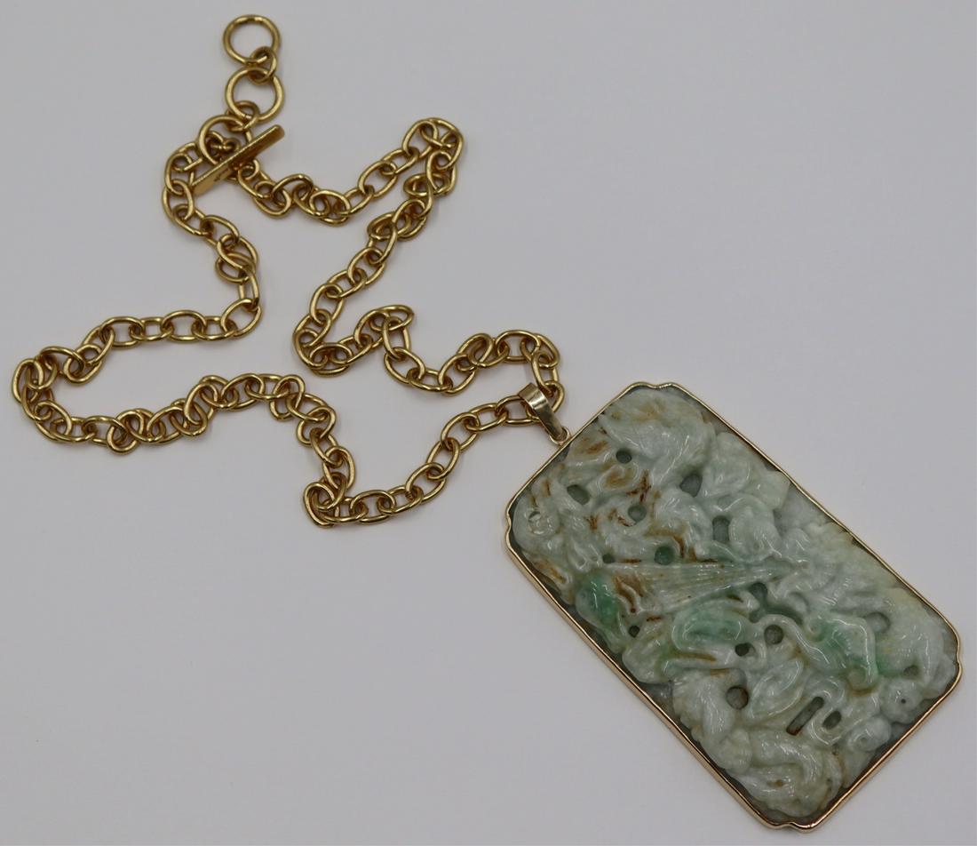 JEWELRY. Large Signed 14kt Gold and Jade Pendant.: Signed 14kt yellow gold mounted carved jade plaque depicting a dragon with flaming pearl set amongst ruyi clouds. Etched lingzhi verso. Bail is stamped, "AJ 14k". Suspended from a gold-tone