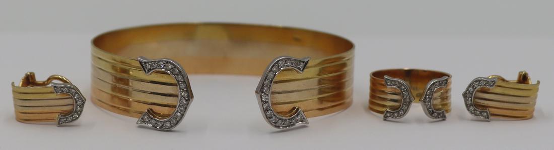 JEWELRY. Cartier Style Double C 'de Cartier' Suite: Cartier style 'de Cartier' Italian tri-color 18kt gold and diamond suite including a bracelet, earrings and a ring. Each item stamped, "750" in a lozenge form frame; ring with an additional 