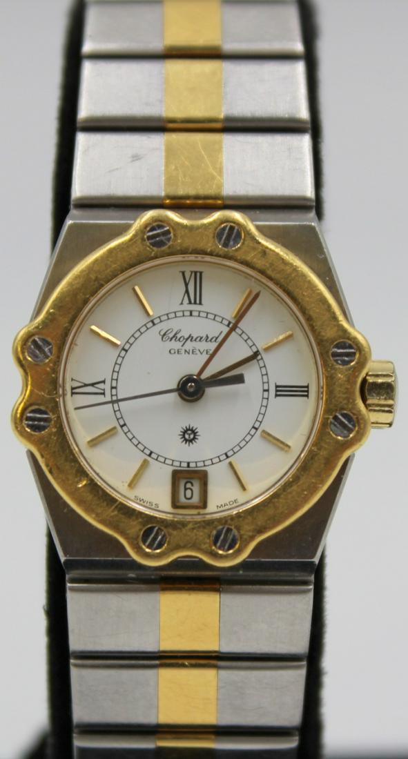 JEWELRY. Lady's Chopard St. Moritz Quartz Watch.: A lady's Chopard St. Moritz two-tone stainless and 18kt yellow gold quartz watch. This watch features 25mm(including crown) stainless round watch case,18kt yellow gold bezel, sapphire crystal, applied