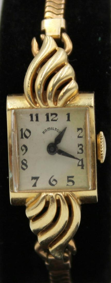 JEWELRY. Lady's Hamilton 14Kt Gold Watch.: A lady's monogrammed Hamilton14kt yellow gold mechanical watch. This watch manufactured in approx. 1947 (based on serial #) features a 14mm (excluding crown) signed Hamilton 14kt yellow gold rectangul