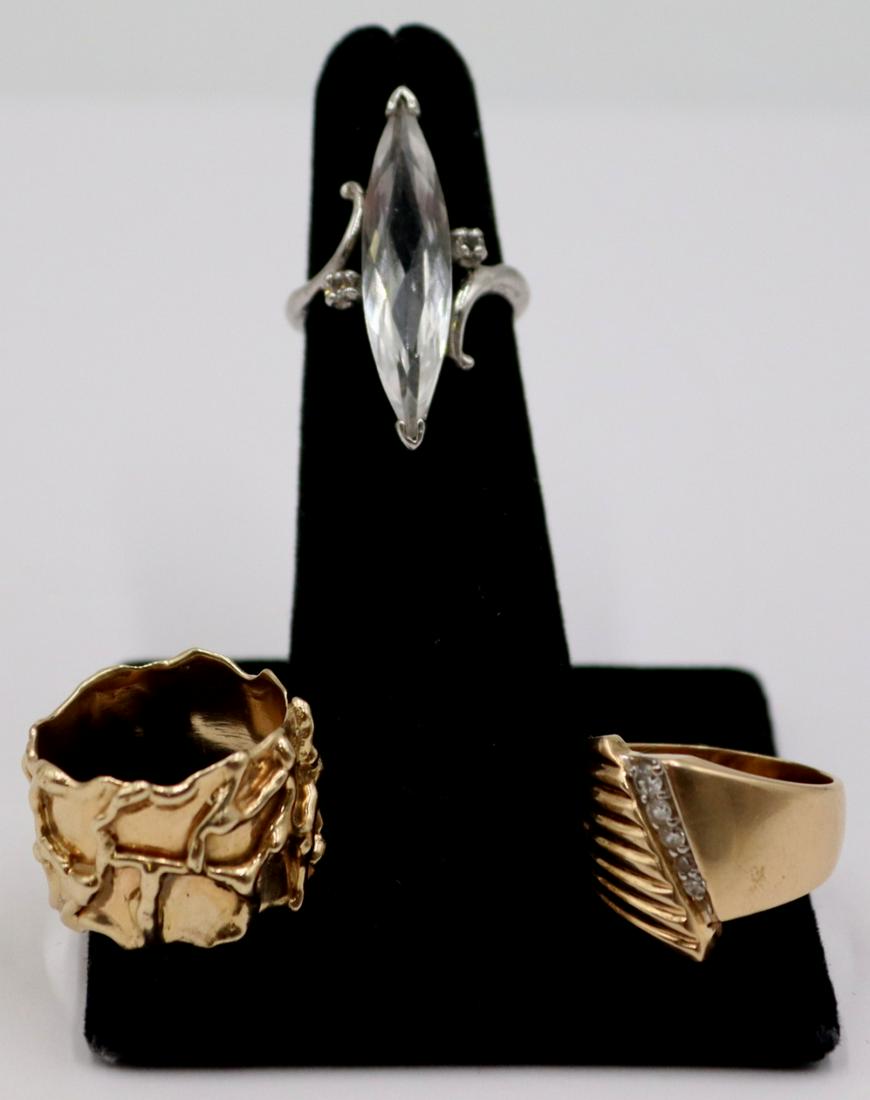 JEWELRY. (3) 14kt and 10kt Gold Rings.: Includes a signed Jose wide 14kt yellow gold band with organic edge and line work - stamped, "Jose 14k", ring size - 7; 14kt yellow gold tapered ring with graduated band of (5) full cut diam