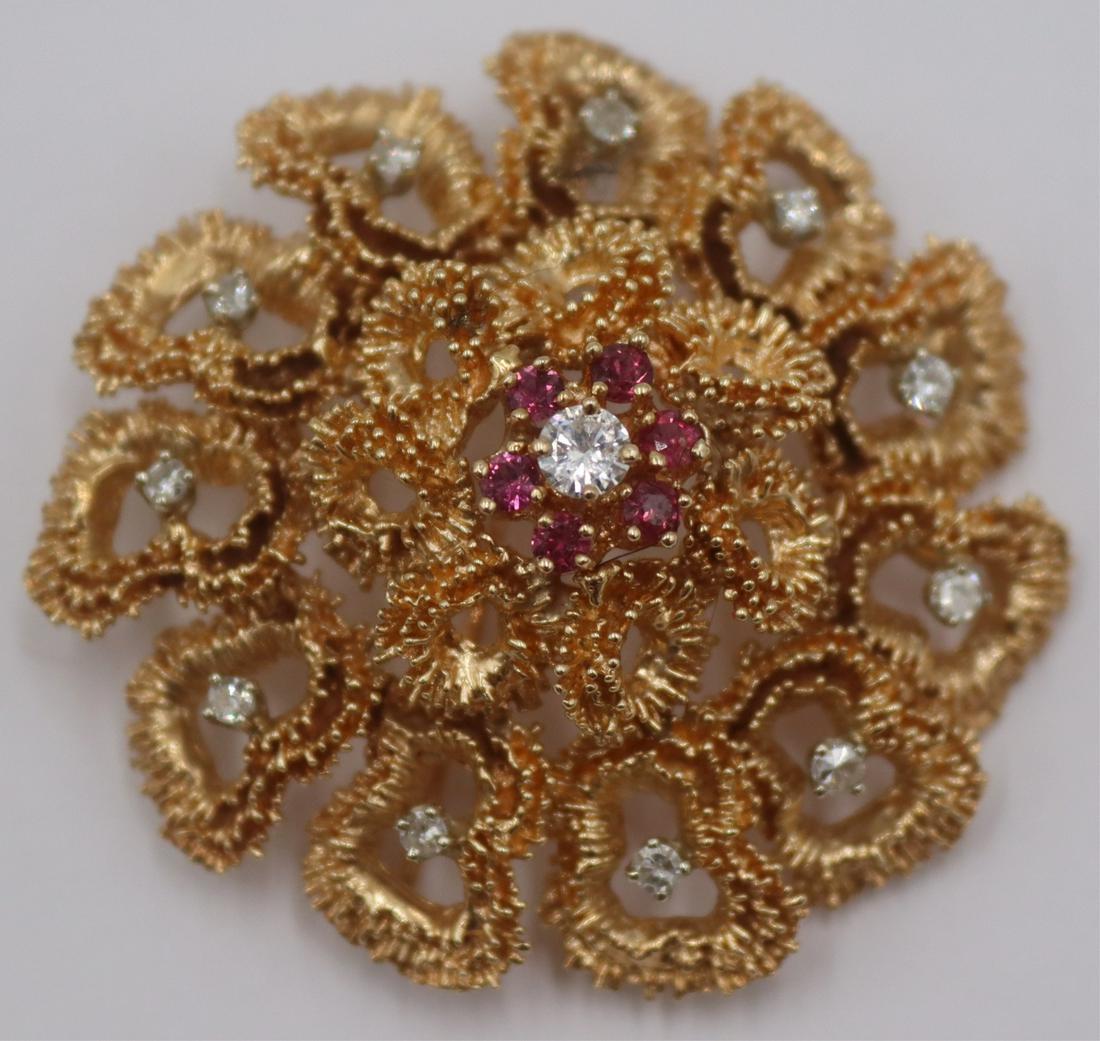 JEWELRY. 14kt Gold, Diamond, and Colored Gem: Brooch. Vintage 14kt yellow gold floral form brooch with center floret comprised of a single diamond measuring approx. 0.15cts surrounded by (6) circular faceted colored gems, and a second tier of (11