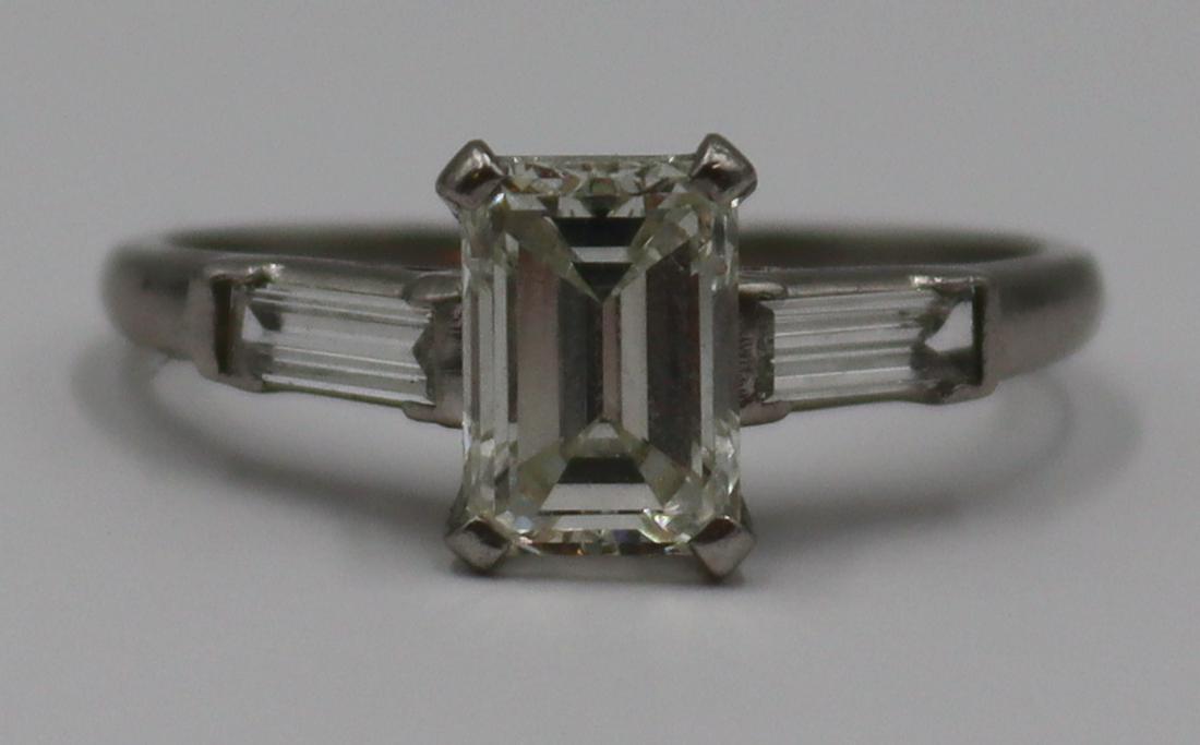 JEWELRY. GIA 1.42ct Emerald Cut Diamond Ring.: Platinum engagement ring with a central prong set 1.42ct emerald cut diamond flanked by straight cut baguettes. Accompanied by a September 21st, 2021 GIA Diamond Report no. 5221031488 stating this is