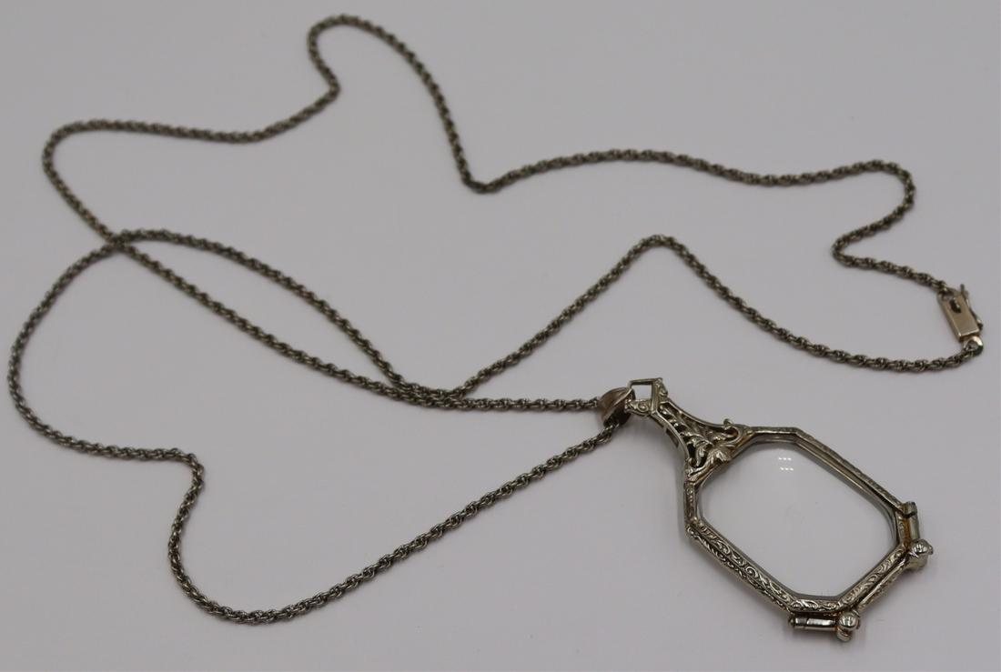 JEWELRY. 14kt Gold Folding Theatre Glasses & Chain: Includes a pair of 14kt white gold folding theatre or opera glasses - with floral details, stamped, "D14K". Suspended from a 14kt white gold chain. Total approx. weight of glasses is 11.6 dw