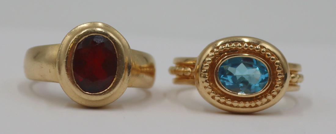 JEWELRY. (2) 14kt Gold and Colored Gem Rings.: Includes a 14kt yellow gold cocktail ring with central faceted oval cut blue colored gem and beaded detailed to bezel and band - stamped, "14K" with an unidentified pictorial hallmark to und
