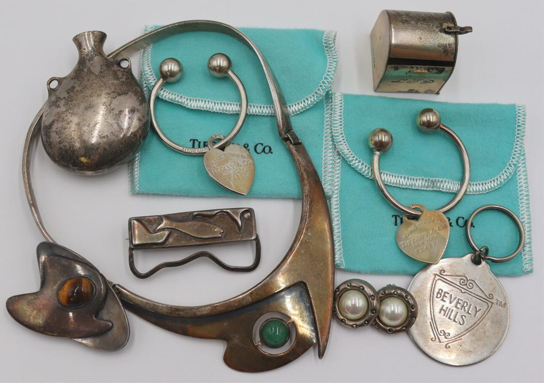 JEWELRY. Silver Jewelry and Objects Inc. Tiffany.: Includes (2) Tiffany & Co. sterling heart form keychains with original dust bags; a miniature monogrammed Tiffany & Co. sterling mailbox; a "Beverly Hills" sterling keychain; a sterl