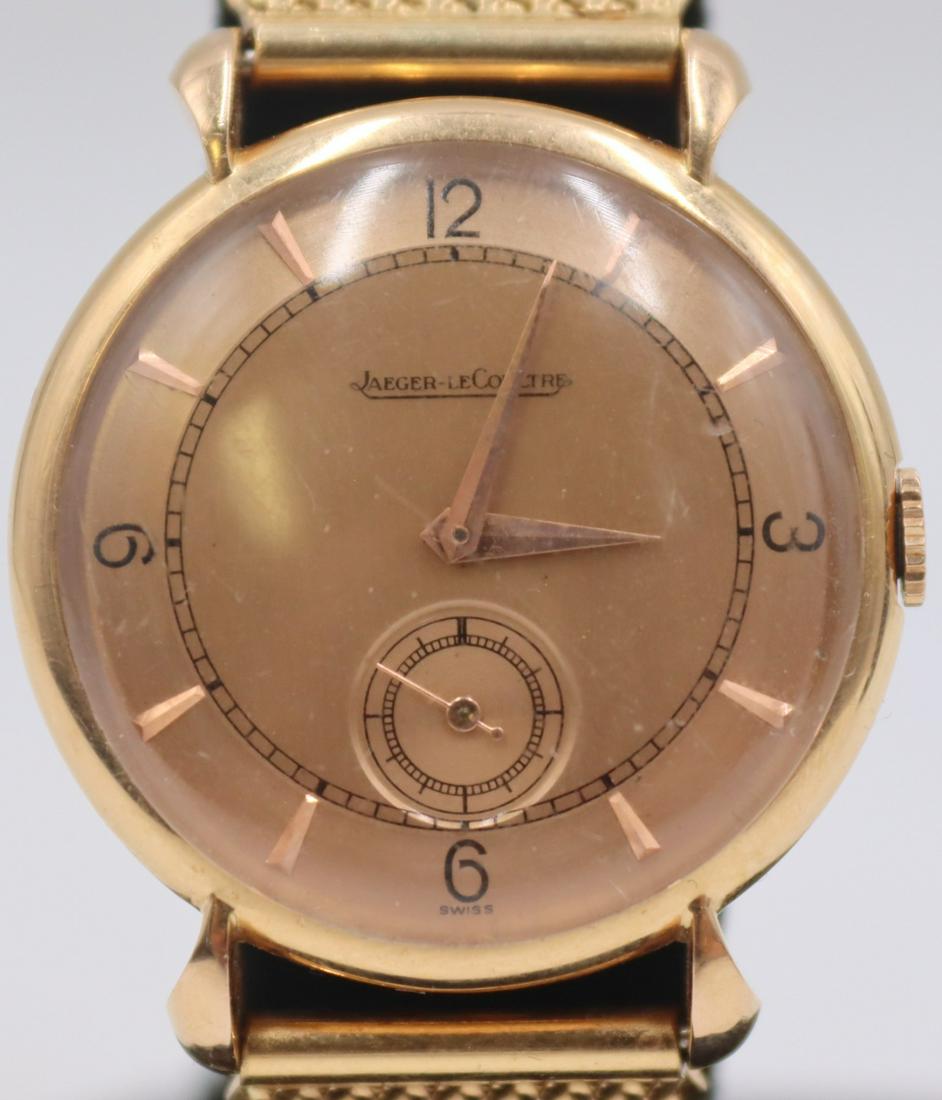 JEWELRY. Men's Jaeger Lecoultre 18kt Gold Watch.: A vintage men's Jaeger Lecoultre 18kt yellow gold watch. This watch features a 32mm (excluding crown) 18kt yellow gold round watch case, tear drop lugs, acrylic crystal, champagne dial, black Arabic n