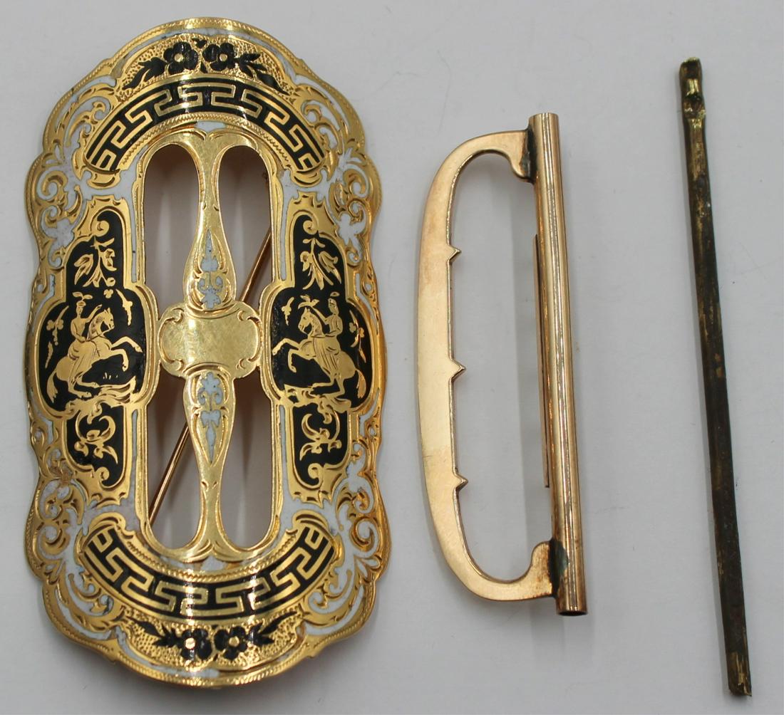 JEWELRY. 14kt Gold and Enamel Buckle.: A 14kt yellow gold and enamel sash/belt buckle converted to a brooch with fine enameling depicting mounted Indians and delicate scroll work. Original chape and pin included. Total approx. weight is 17
