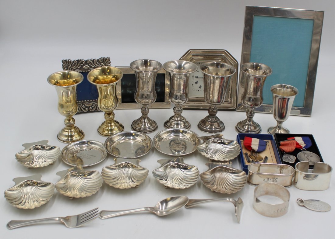 STERLING. Grouping of Sterling Inc. Tiffany & Co.: Including a Tiffany & Co. sterling Please Return To Tiffany & Co. oval key ring tag; a Tiffany & Co. sterling small rectangular picture frame - stamped, "Tiffany & Co. Makers Sterling 83814 925"; an e
