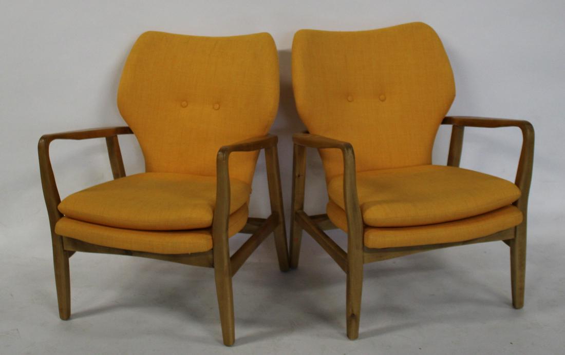 A Pair Of Midcentury Style Upholstered Arm Chairs: Nice quality reproduction. From a Roslyn NY estate. - Dimensions: 35" x 26" x 28"