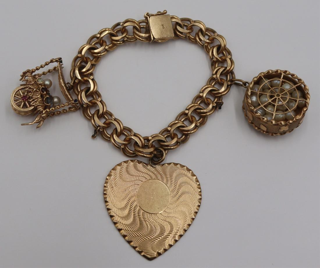 JEWELRY. 14kt Gold Charm Bracelet and (3) Charms. (1 of 10)
