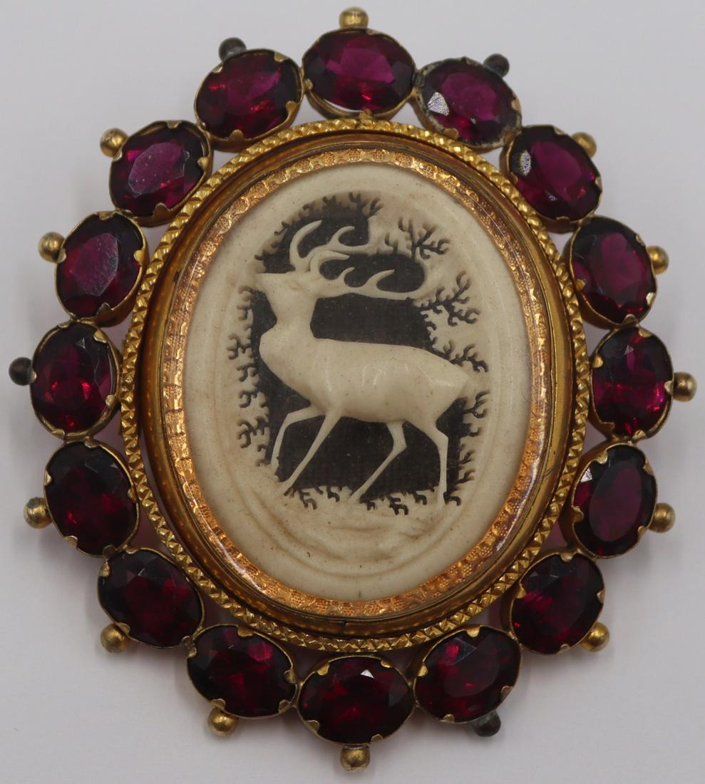 JEWELRY. Victorian Carved Stag Swivel Brooch.: Victorian swivel form brooch with a central carving of a stag and locket to alternate side. (16) oval cut faceted colored gems to surround. From the estate of a world traveler and gemologist. Dimensio