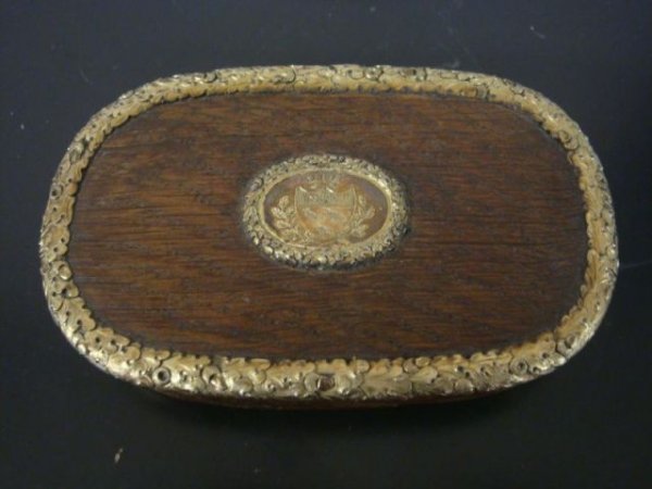Antique Gilt-Silver (?) and Oak Lidded Box.: With insert crest or coat of arms of three ravens under lion passant with crown above. Probably English or Anglo-English. Gilt-metal details of oak leaves and acorns. From a Hartsdale, NY home. Dimens