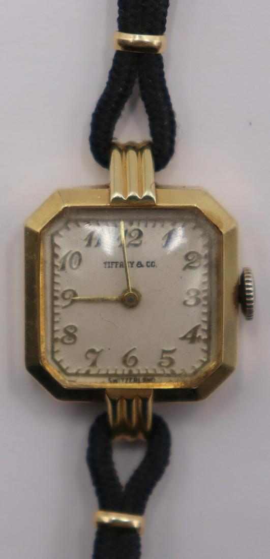 JEWELRY. Lady's Movado Tiffany & Co. 14kt Gold: Watch. A ladies vintage Movado 14kt gold watch for Tiffany & Co. This watch by Movado features an 18mm(excluding crown) Schwab & Wuispard Case Co. 14kt yellow gold square case with tapered cor