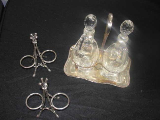 Vinegar Set and a Pair of CHRISTOFLE holders.: Approx. 18 troy oz. (excluding glass jars). From a Pelham Manor estate. Dimensions: Jars - 7" high.