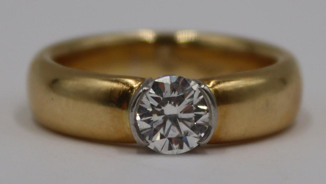 JEWELRY. Tiffany & Co. Etoile .75ct Diamond, 18kt: and Platinum Ring. Tiffany & Co. Etoile 18kt yellow gold ring with a central round brilliant cut diamond in a platinum surround. Diamond measure approx. 0.75cts, approx. color of F/G, approx. clar