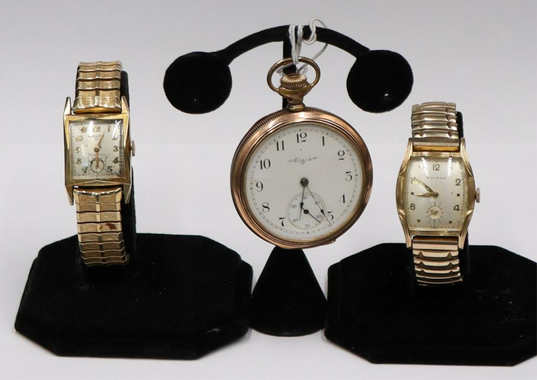 JEWELRY. Men's Gold Tone Watch Grouping.: Including a men's Gruen 10kt yellow gold filled mechanical watch on a Speidel gold tone stretch bracelet; a men's Bulova 10kt yellow rolled gold plate mechanical watch on a Flex-Let 1/2010kt gold fill