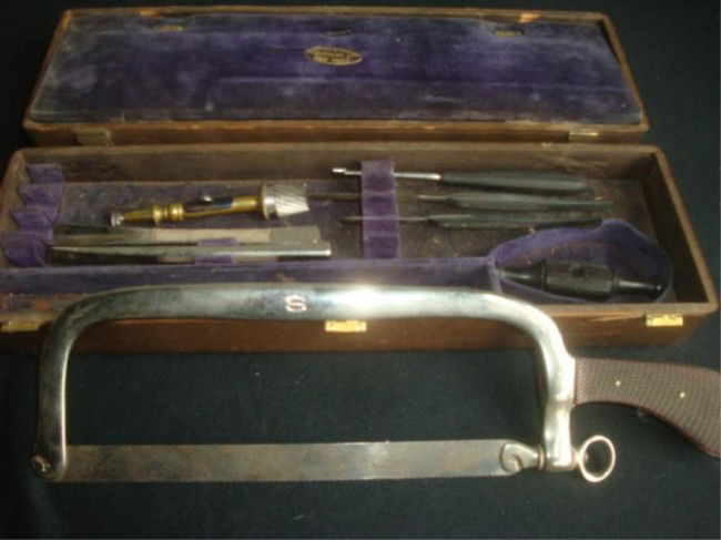 c.1870 Shepard & Dudley Doctor's Saw in Case.: A surgeon's saw with 9" blade, 7 additional miscellaneous pieces including chisels, and spare blades. From a Bronxville home. Condition: Various.