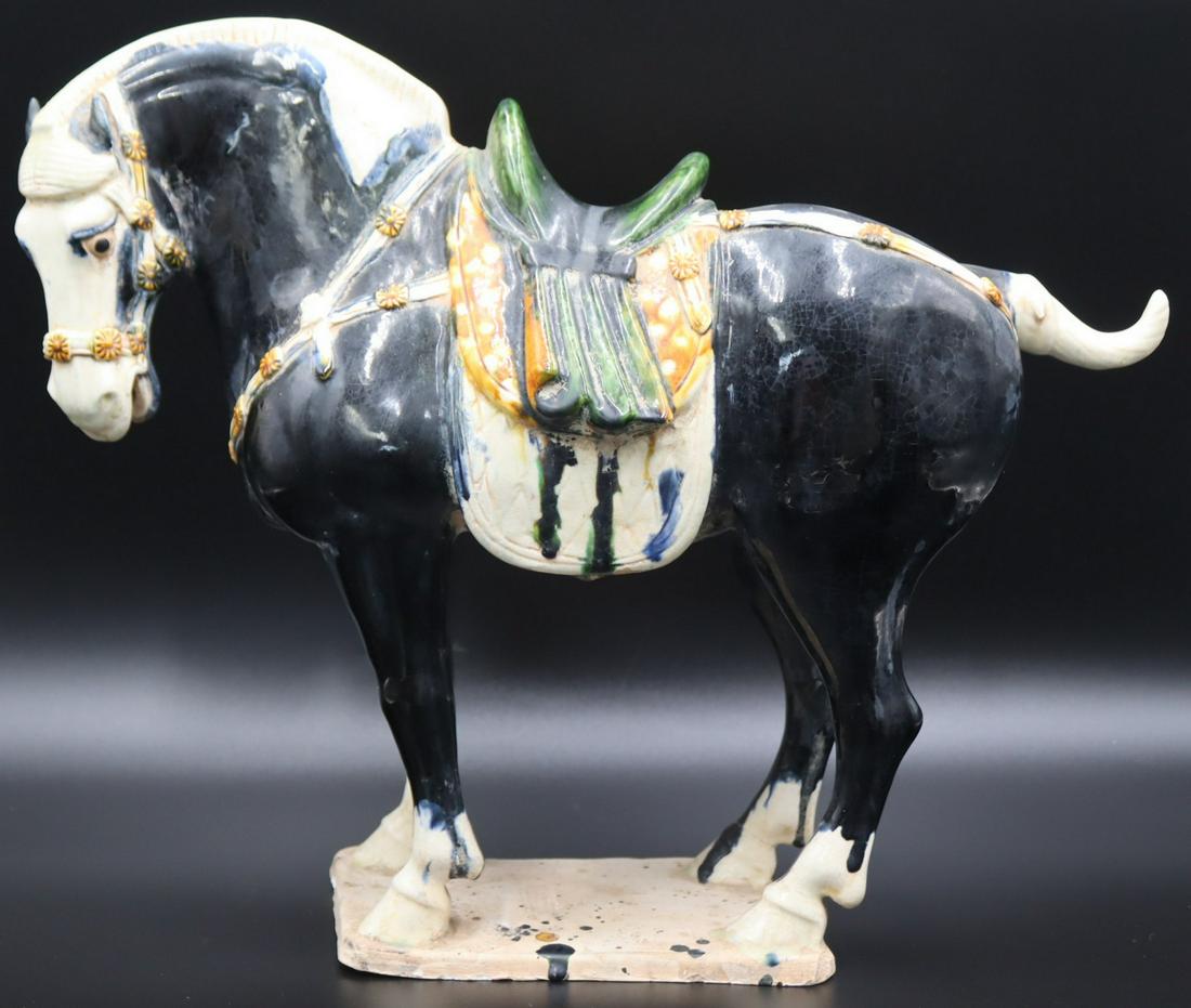 Signed Chinese Glazed Tang Style Horse Roof Tile.: With signature to base. From a Great Neck, NY estate. Dimensions: horse measures approx. 17" w x 6.5" d x 14" h.