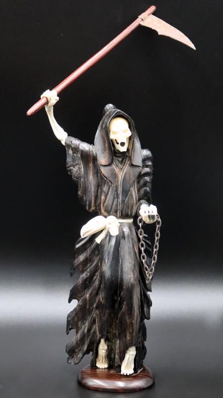 Carved Bone and Wood Figural Depiction of Death.: Standing figural depiction of "Death" or the Grim Reaper as a robed skeleton carrying a scythe in one hand and a chain in the other. From a Mt Vernon, NY collection. Dimensions: figure on ba