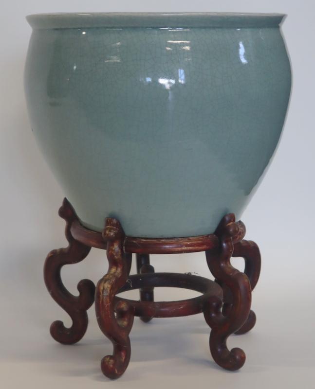 Large Chinese Crackle Glaze Celadon Fish Bowl.: Large Chinese crackle glaze celadon fish bowl. On carved wood stand. From a Hastings-on-Hudson, NY estate. Dimensions: fish bowl measures approx. 16.75" in diameter x 13.75" h.