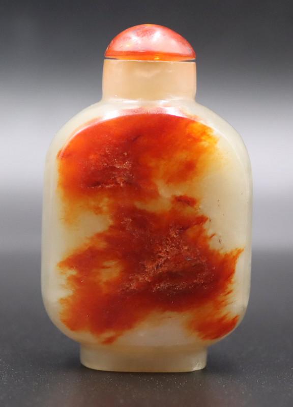 Chinese Carved Russet Jade Snuff Bottle.: Chinese carved russet jade snuff bottle with amber stopper. Total approx. weight of snuff bottle is 53.2 grams (gross) excluding stopper. From a Sleepy Hollow, NY estate. Dimensions: snuff bottle and 