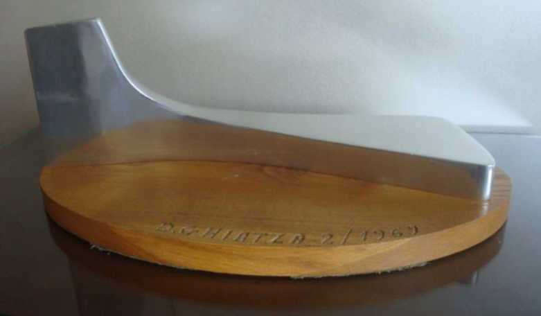 GHIATZA, Daniel. 1969 Sculpture "Forme Arctique 2": Signed on wood base and accompanied by a 1969 certificate of authenticity. Polished aluminum on wood base. This is a unique piece vs a multiple edition. Daniel Ghiatza, Israeli/French, 1915 -. Dimensi