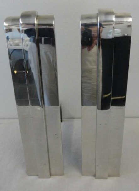 Pair of Chrome Midcentury Andirons.: From an apartment designed by Karl Springer at 510 Park Ave NYC. Dimensions:16" high.