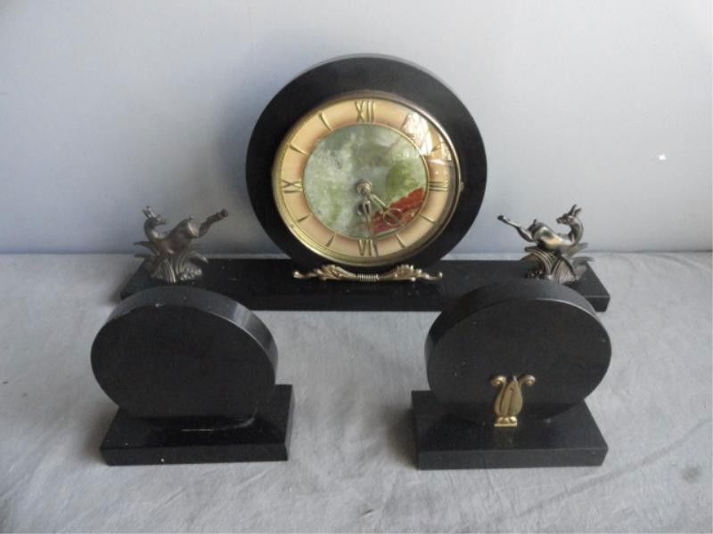 Art Deco Three Piece Clock Garniture Set with: Picture Jasper Face & Two Bronze Antelopes. From a Scarsdale, NY home. Dimensions: clock -18" wide x 2.5" deep x 8.75" high; side pieces - 4.75" wide x 2" deep x 5" high.