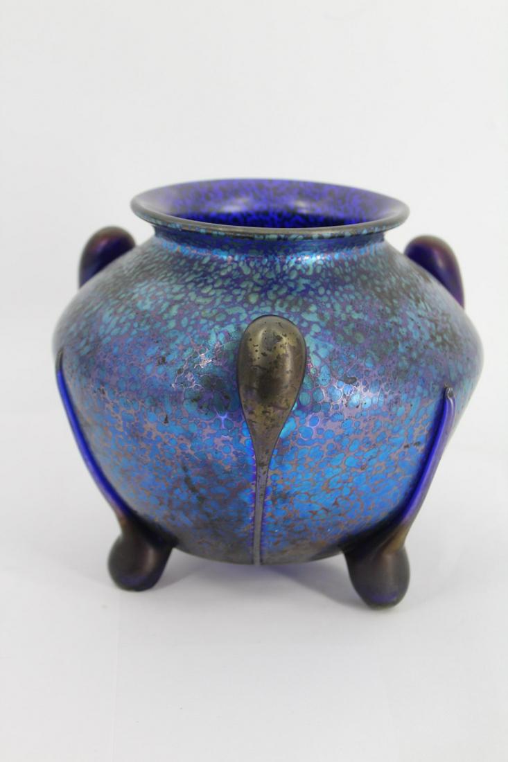 Loetz Art Glass Electric Blue Vase with Three Feet: Early 20th Century, greenish-blue iridescent oil-spot decoration over blue glass, polished pontil mark and feet. From a New Rochelle, NY estate. - Dimensions: 6.5" h x 4.5" w.