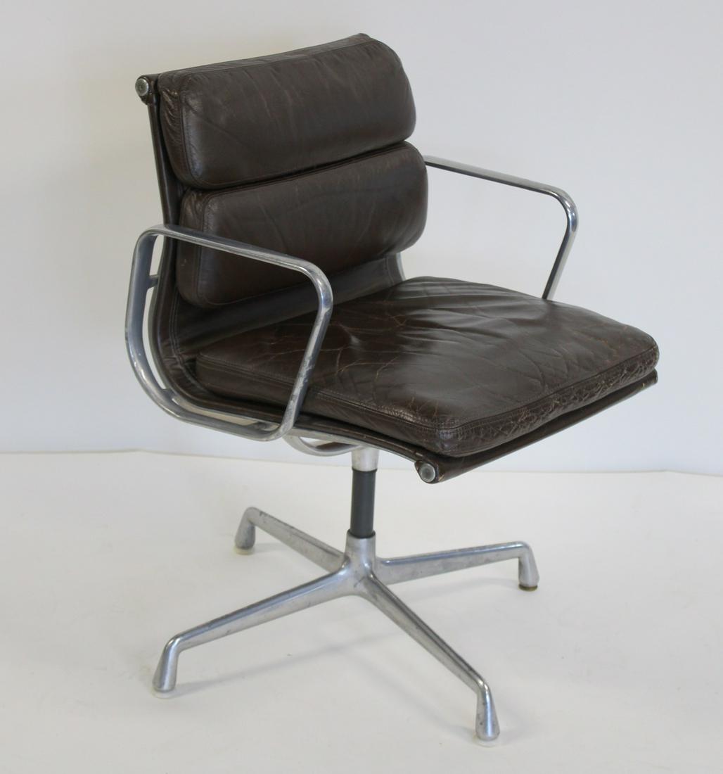 Midcentury Herman Miller Executive Office Chair: Soft Pad Chocolate Brown Leather. Chair Swivels and Signature in the metal and tag still present. From a Long Island NY Estate. - Dimensions: 34"h x 20"d x 20"w