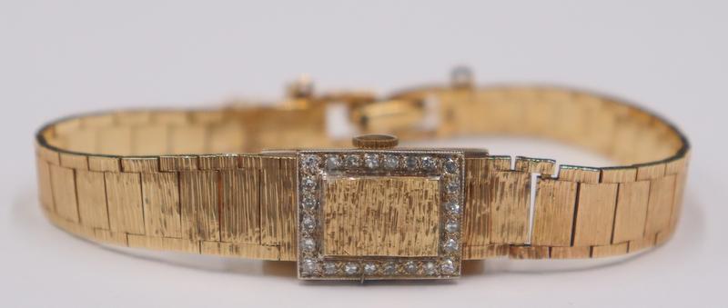JEWELRY. Lady's 14kt Gold and Diamond Watch. (1 of 9)