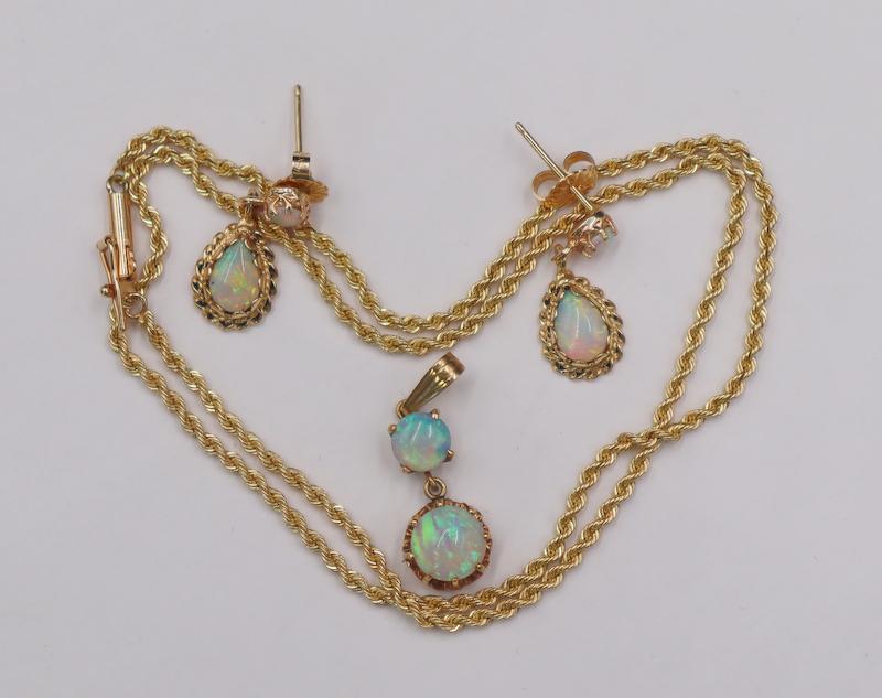 JEWELRY. 14kt Gold and Opal Jewelry Grouping.: Including a 14kt yellow gold rope choker - stamped, "14K"; pair of 14kt yellow gold studs with with central round opal cabochon suspending a drop cut opal cabochon; and a 14kt yellow gold pe
