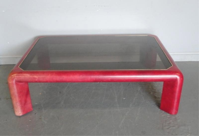 Karl Springer Red Leather Cocktail Table.: Midcentury. Signed. From a Roslyn, NY estate. Dimensions: 59" wide x 41" deep x 17.5" high.