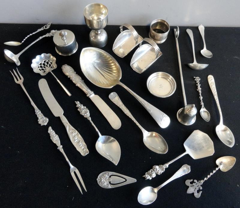 Sterling. Lot Including Bright Cut Serving Spoon,: Egg Cup, Candle Snuffer, Two Small Lunt Baskets, Pocket Knife, Kirk Money Clip, Small Serving Pieces, Small Ladle, Pickle and Meat Forks and Miscellaneous Spoons. Approx. 18.5 troy oz. Dimensions: Bri