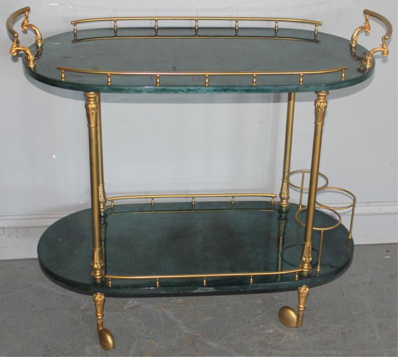 ALDO TURA Rolling Bar Cart with Goatskin Top.: Midcentury With partial label. From a Long Island location. Dimensions: 33.5" x 16" x 30" high. Condition: Some chips, also divits to top.