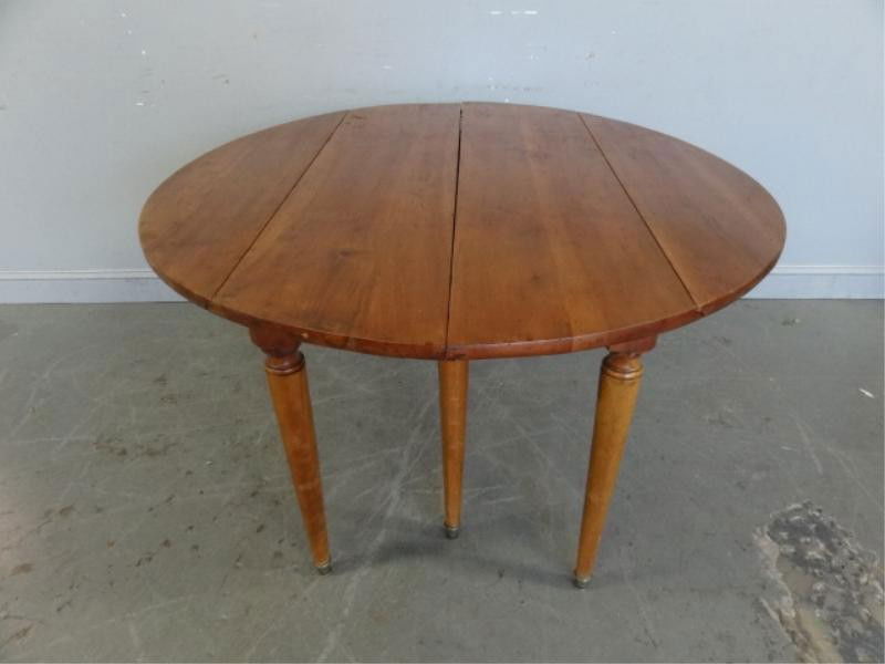 French Cherrywood Drop Leaf Dining Table.: From a White Plains, NY home. Dimensions: 52.75" wide x 28" high x 25.5" closed / 49" open plus 4-18" leaves.