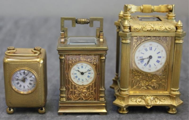 3 Miniature Gilt Bronze Clocks.: From a NYC location. Dimensions: Range in height from 2" - 3.5" high.