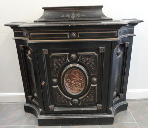 Victorian Ebonized Credenza with Oval Metal Plaque: From a Yonkers, NY home. Dimensions: 54" wide x 18.5" deep x 46" high.